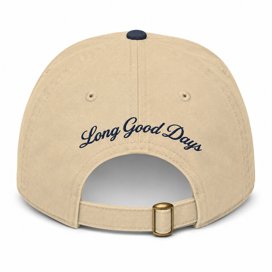 Beige cap with 'Long Good Days' text on a white background