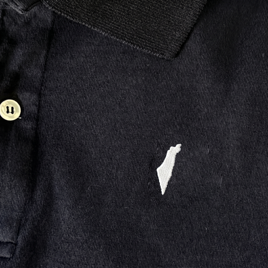 Black polo shirt with a small white israel logo on a white background
