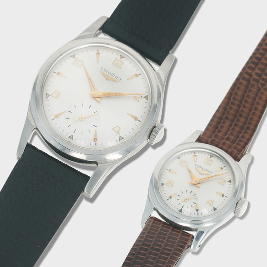 Two vintage longines watches with different strap colors on a light gray background