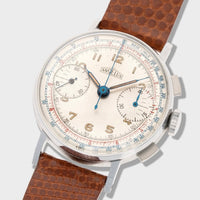 Vintage watch with a brown leather strap on a white background