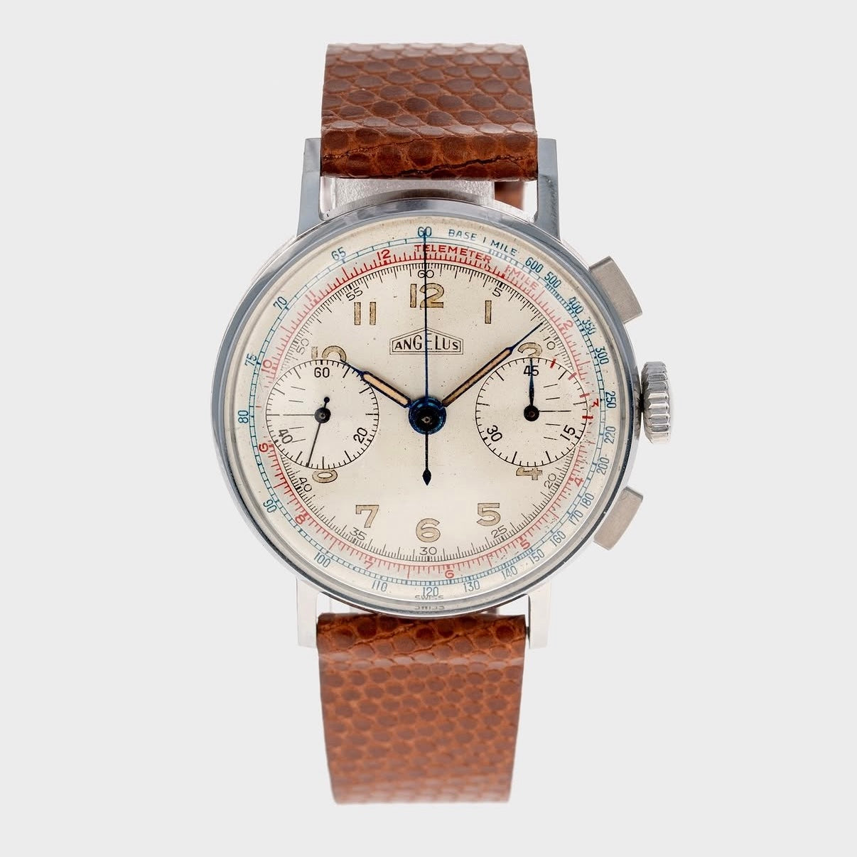 Vintage watch with a brown leather strap on a white background