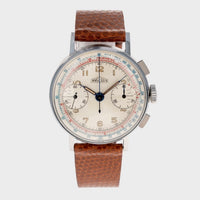 Vintage watch with a brown leather strap on a white background