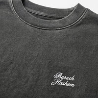 Vintage black crew neck sweatshirt with 'Baruch Hashem' text on a white background