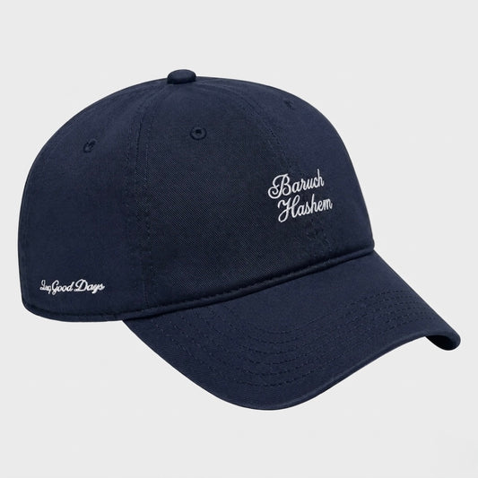 Navy blue cap with 'Baruch Hashem' embroidered on a light gray background