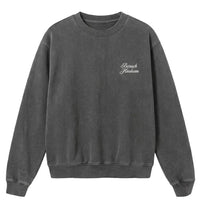 Vintage black crewneck with 'Baruch Hashem' text on a white background
