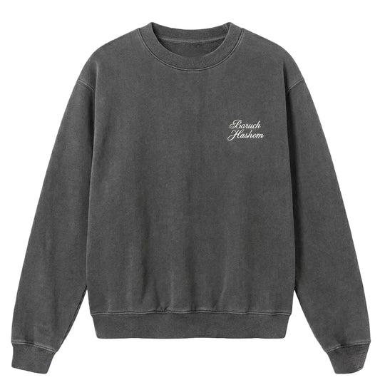 Vintage black crewneck with 'Baruch Hashem' text on a white background
