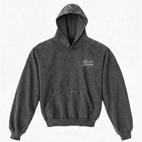 Vintage black hoodie with 'Baruch Hashem' text on a white background
