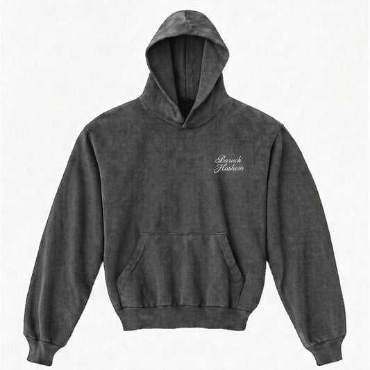 Vintage black hoodie with 'Baruch Hashem' text on a white background