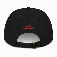 Black cap with 'Shlita' embroidered on the back against a white background