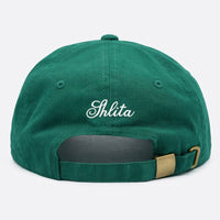 Green cap with 'Shlita' embroidered on the back against a white background