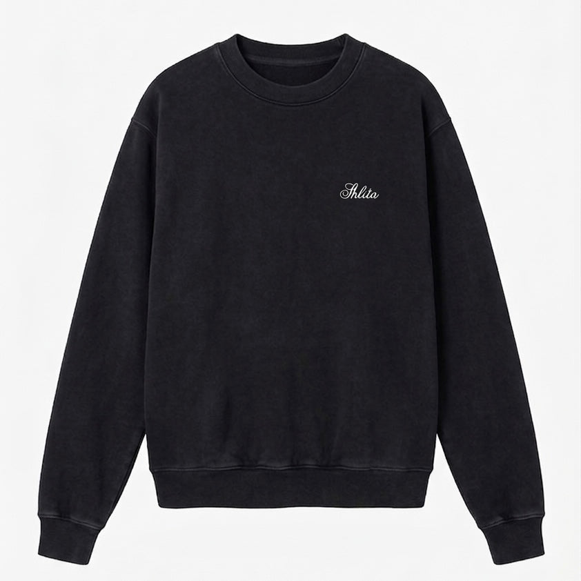 Black sweatshirt with white Shlita branding on a light gray background