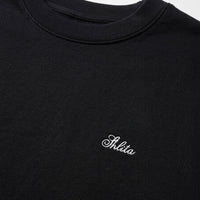 Black sweatshirt with 'Shita' logo on a white background