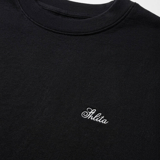 Black sweatshirt with 'Shita' logo on a white background