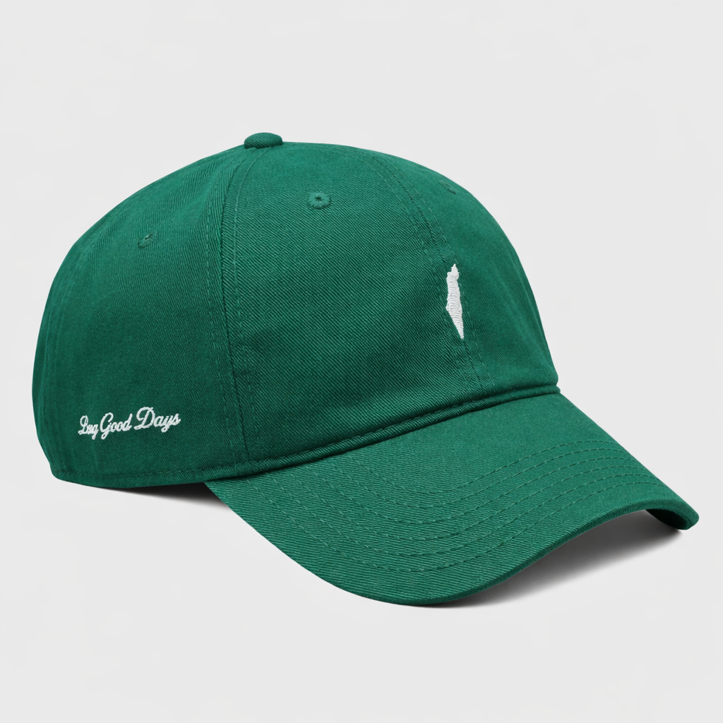 Green baseball cap with 'Long Good Days' text on a light gray background