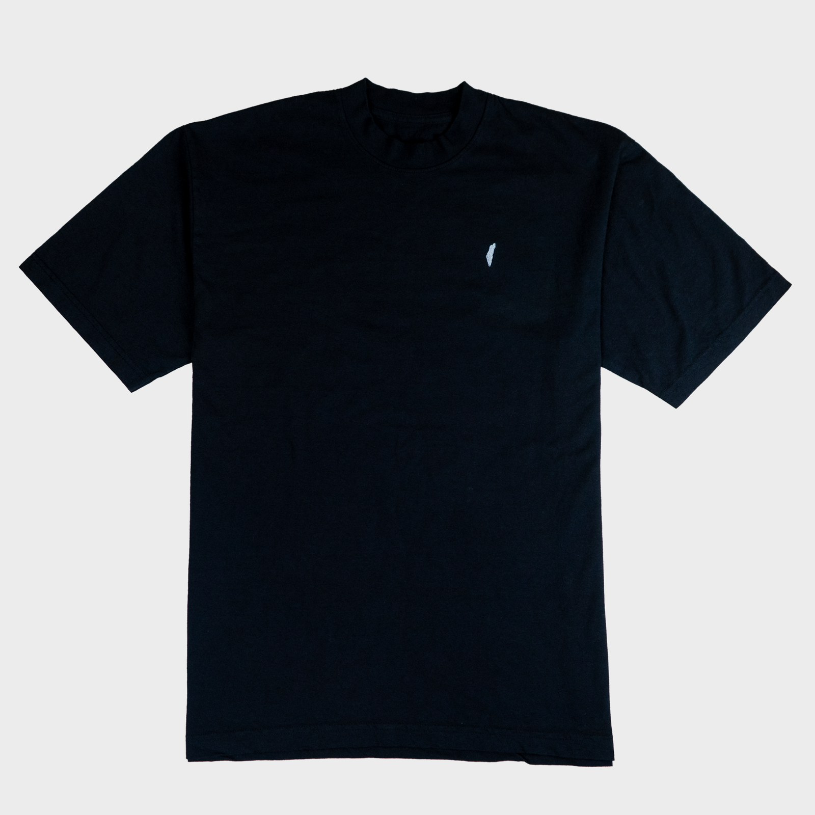 Black t-shirt with a small white logo on a light gray background