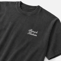 Black Shlita t-shirt with Baruch hashem script text on a white background