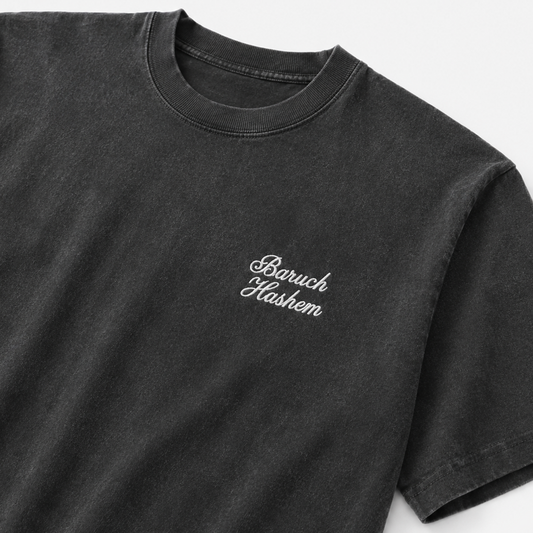 Black Shlita t-shirt with Baruch hashem script text on a white background