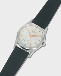 Vintage Longines Men's Wristwatch with black strap and silver case on a light gray background